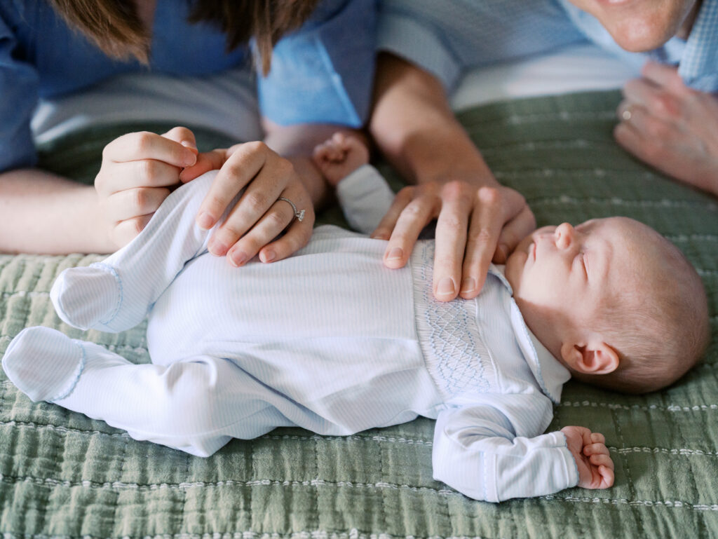 newborn family photos on bed lifestyle session High Point NC