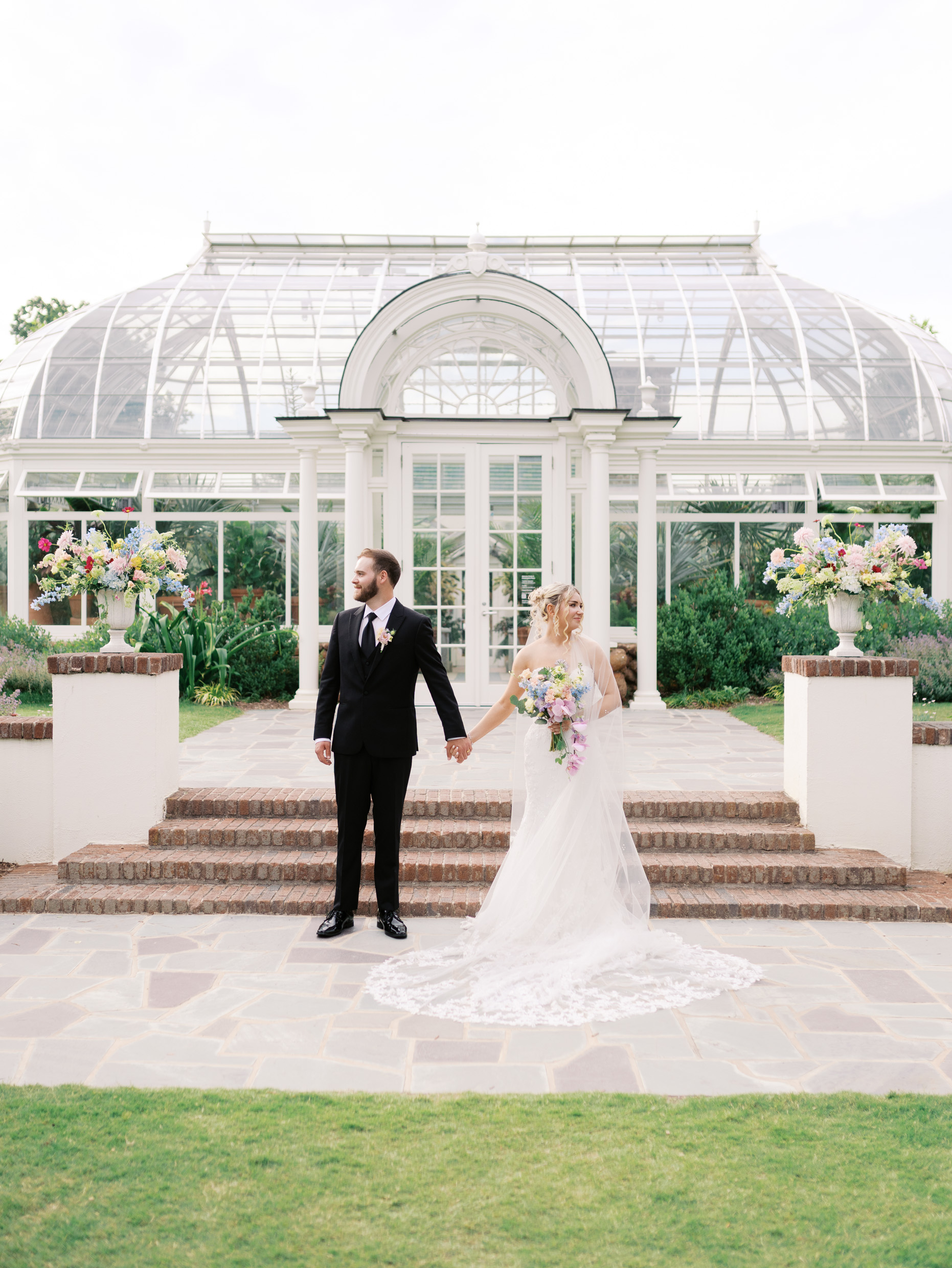 Colorful wedding ceremony in front of the Reynolda Gardens conservatory